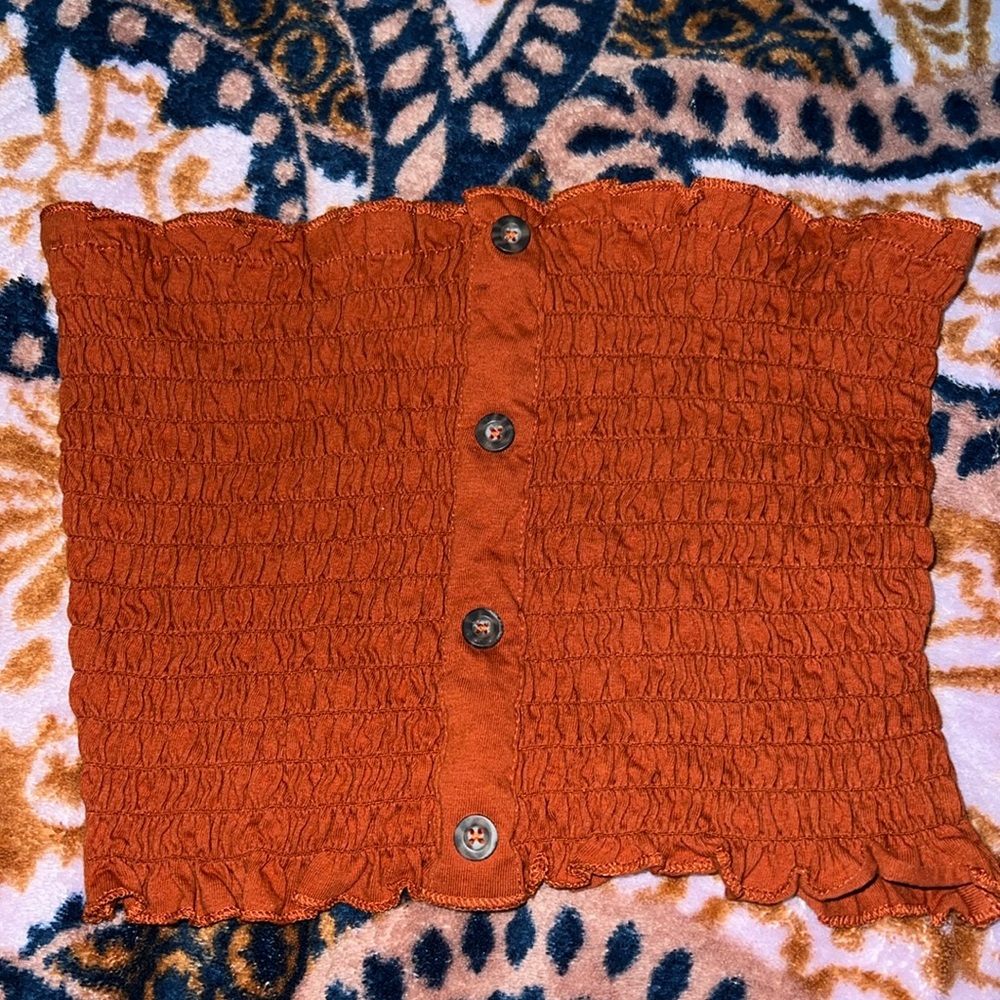 Burnt orange tube top ruffled with buttons down the middle